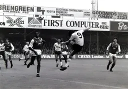 Mick Harford gets in a strong header