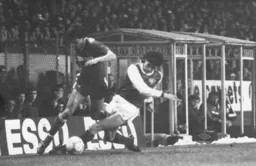 Marc North rides a challenge from Martin Keown
