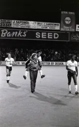 Mark Stein gets carried off by Ashley Grimes at the end of the match