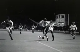 Mick Harford gets past Anderson
