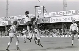 Mick Harford high above the Everton defender
