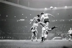 Mal Donaghy gets up high but Paul McGrath heads the ball clear