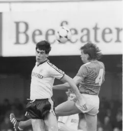 Mike Newell in a heading duel with Pat Van Den Hauwe