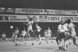 Mal Donaghy wins a header in the Albion penalty area