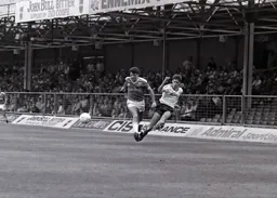 Mike Newell gets past Paul Ramsey and sends the ball towards the penalty area