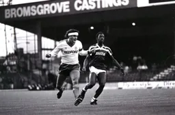 Steve Foster and Garry Thompson follow where the ball has gone