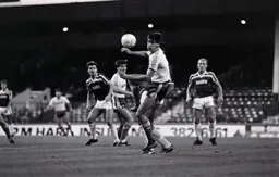 Mike Newell watches the ball go across him