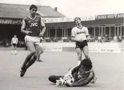 Robert Wilson looks on as Arsenal keeper John Lukic gathers the ball