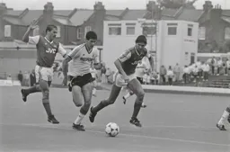 Mike Newell goes past Kenny Sansom and Tony Adams