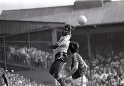 Ricky Hill heads the ball on