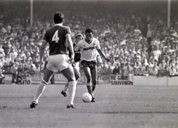 Brian Stein runs at Tony Gale