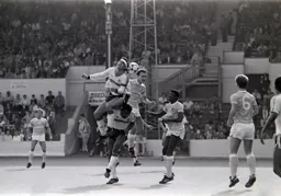 Steve Foster climbs above Ricky Hill to reach the ball