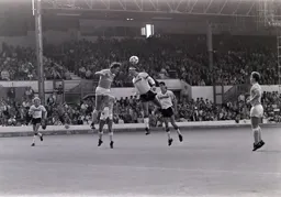 Steve Foster is beaten to the ball by Kenny Clements