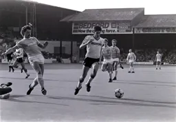 Mike Newell goes after the ball after Kenny Clements knocks it away