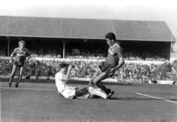 Mike Newell is tackled by a grounded Gary Mabbutt