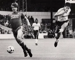 Mike Newell gets off the ground as he fires in the first goal