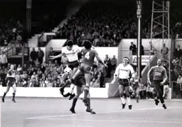 The ball drops between Mike Newell and Mark Lawrenson