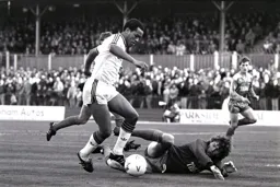 Brian Stein takes ball away from a grounded Dave Beasant