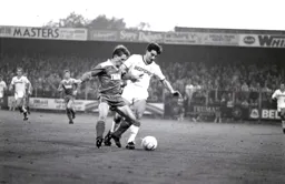 Robert Wilson and Steve Galliers compete in midfield