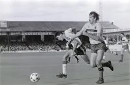 Mike Newell and Steve Sims jostle for the ball