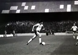 Mick Harford brings the ball forward