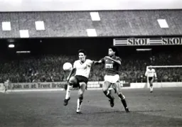 Mick Harford brings the ball under control as Des Walker closes in