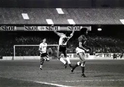 The ball has gone over Brian Stein and Des Walker