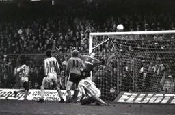 Les Sealey tips the ball over the bar