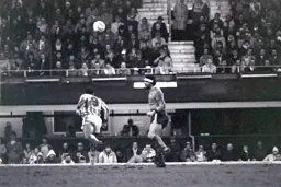 Steve Foster heads the ball clear