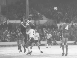 Bruce Grobbelaar punches the ball clear as Brian Stein makes his presence felt