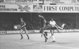 Mick Harford stoops to attempt a header at goal