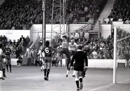 David Seaman cuts out a high ball with Steve Foster the intended target