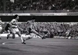 Mike Newell goes for goal from the edge of the penalty area