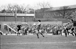 Robert Wilson twists as the looks to control the ball