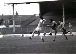 John Gidman cannot stop Ricky Hill`s attempt at goal