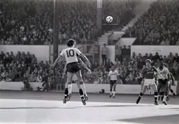 Mick Harford hangs in the air after heading the ball into the penalty area
