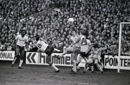 Brian Stein swings a leg as the ball goes high