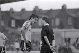 The referee Mr Elleray has a word with Mick Harford