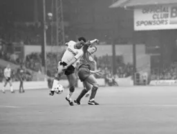 Brian Stein takes the ball past Andy Thorn