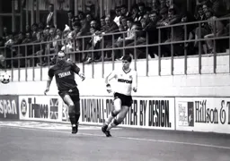 Richard Harvey plays the ball inside before Alan Cork can intervene