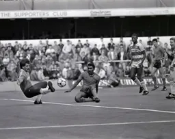 Ricky Hill is thwarted by the outstretched boot of David Seaman