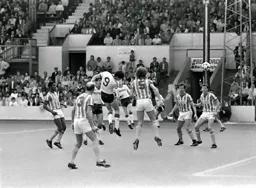 Mike Newell strains his neck to send a header towards the goal