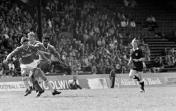 A tangle of legs with Ricky Hill and Paul Miller