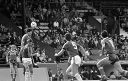 Mick Harford rises highest against Paul Miller