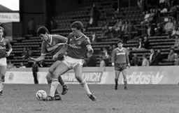 Mike Newell tussles for the ball