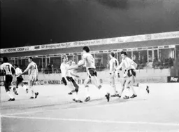 Mike Newell carries the ball back to the centre circle after scoring the Town`s first goal