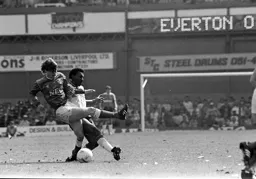 Ricky Hill and Ian Snodin challenge for the ball