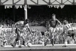 Brian Stein controls the ball as Dave Watson closes in