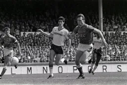 Mike Newell and Dave Watson chase after the ball