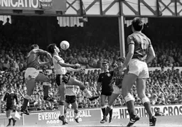 Mike Newell attempts to control a high ball